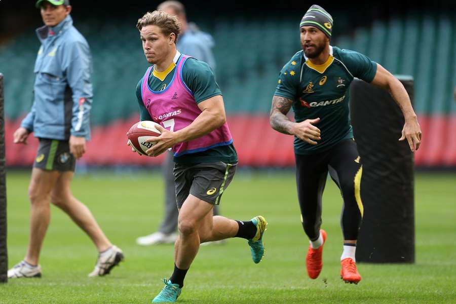 Michael Hooper (L) and Quade Cooper (R) have been left out of Australia's squad for the World Cup