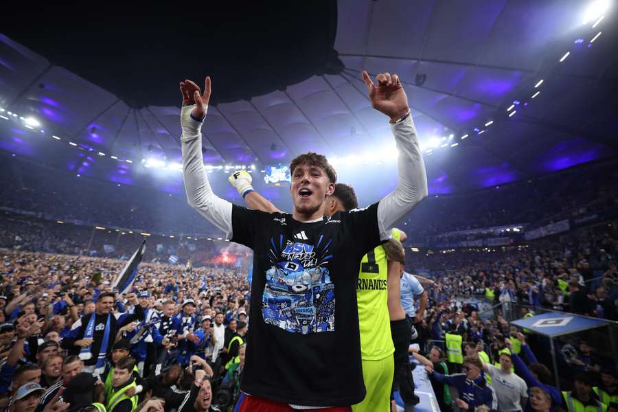 Hamburg's players celebrate with their fans after thrashing Ulm 6-1