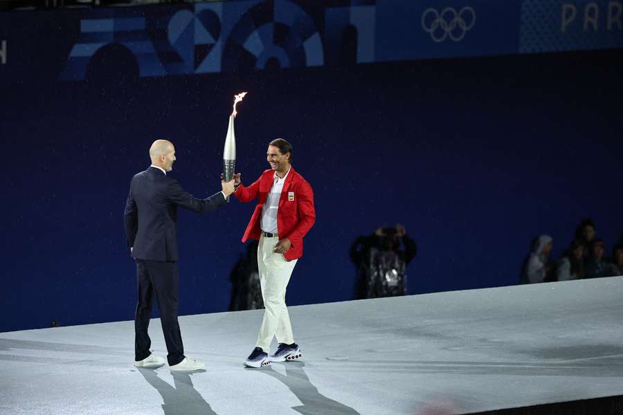 La transmission de la flamme olympique entre 