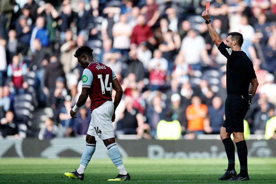 Referee Andrew Madley shows a red card to West Ham United's Mohammed Kudus