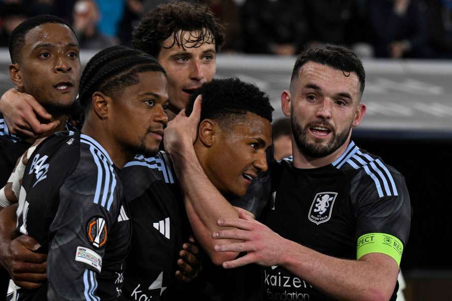 Aston Villa's Ollie Watkins celebrates scoring their third goal with John McGinn