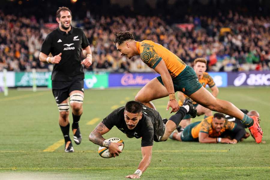 New Zealand's Rieko Ioane scores a try during the Rugby Championship