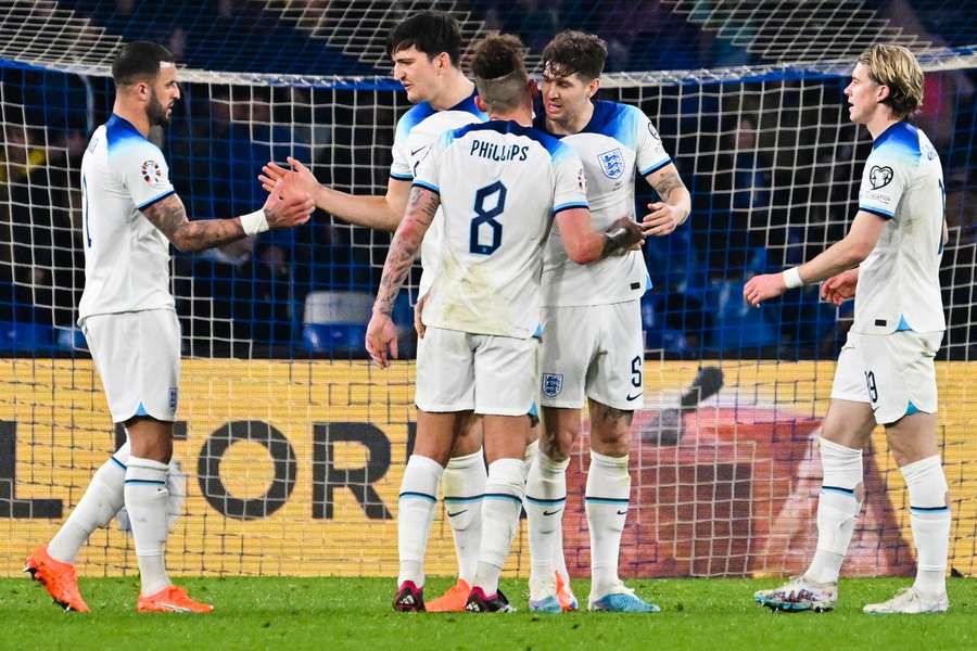 (From L) England's Kyle Walker, Harry Maguire, Kalvin Phillips, John Stones and Conor Gallagher celebrate 