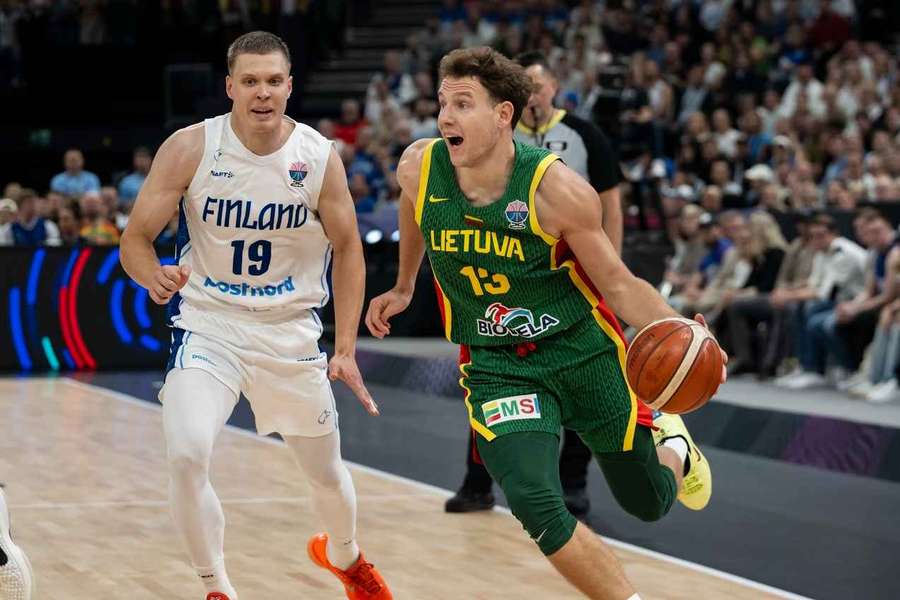 Rokas Jokubaitis drives down the court for Lithuania