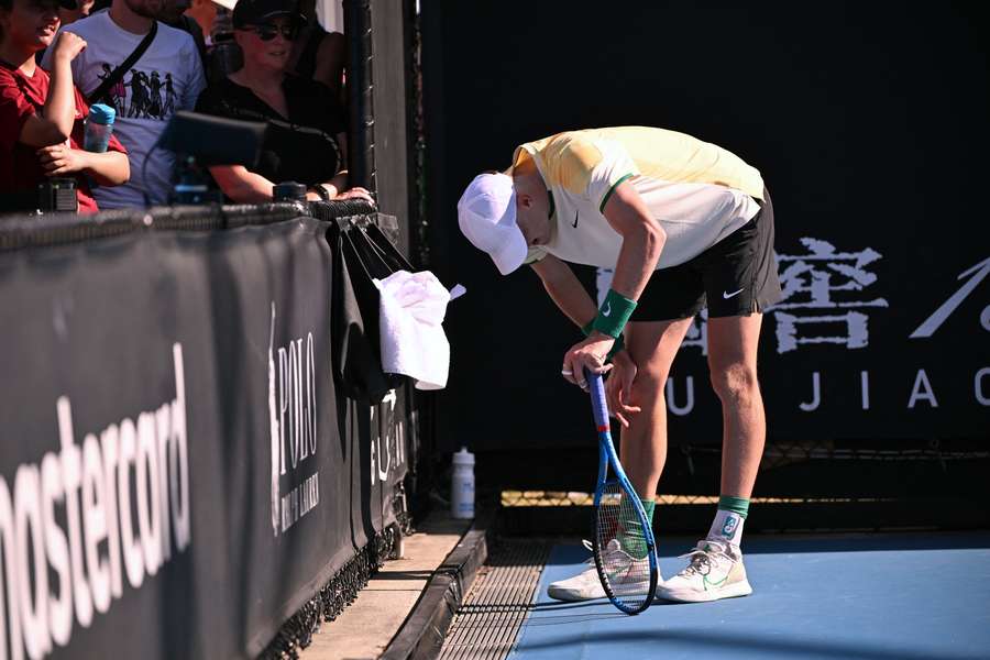 Britain's Jack Draper reacts in pain with an abdomen injury after winning his men's singles match against USA's Marcos Giron