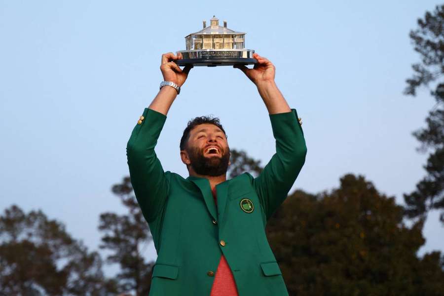 Rahm celebrating with his trophy