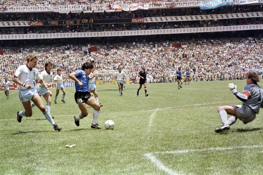 Argentina's Diego Maradona dribbles past England goalkeeper Peter Shilton during the 'Goal of the Century'