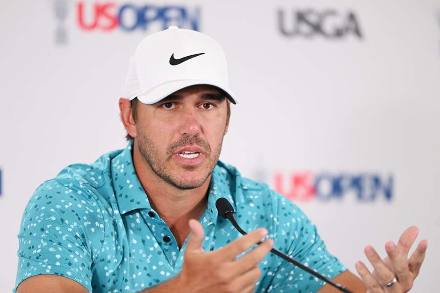 Brooks Koepka of the United States speaks to the media during a press conference