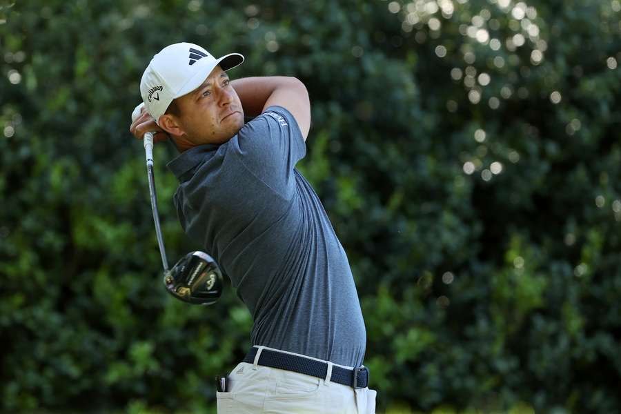 Xander Schauffele of the United States plays his shot