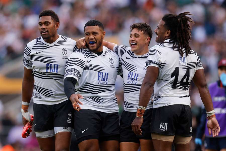 Fiji players celebrate after the match