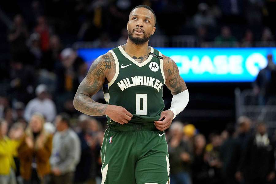 Milwaukee Bucks guard Damian Lillard walking off the the court after a matchup against the Golden State Warriors