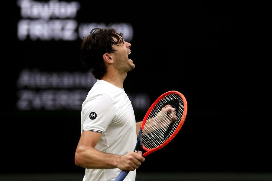 Taylor Fritz celebrates after winning his fourth-round match against Alexander Zverev