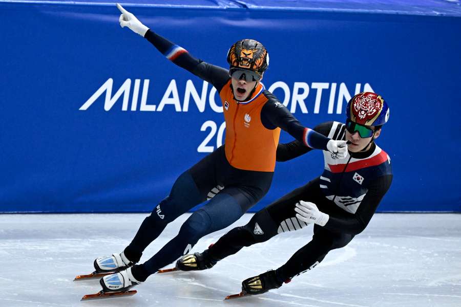 The Netherlands' Jens van 't Wout celebrates winning the gold medal in the men's relay