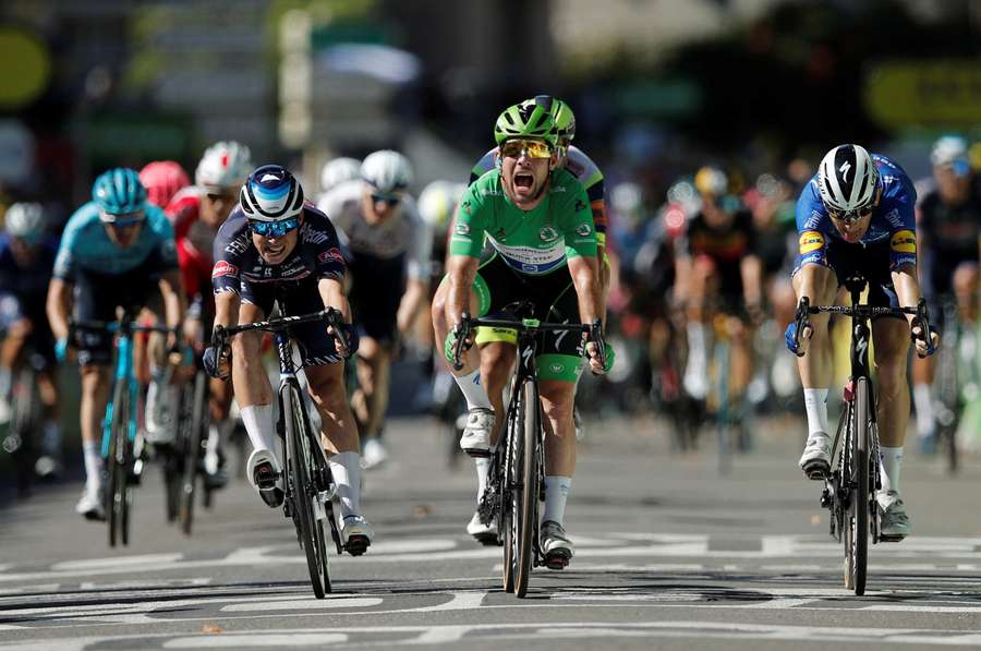 Mark Cavendish, centre, is likely to be one rider who has seen both COVID-19 protocols at the Giro and at the Tour de France