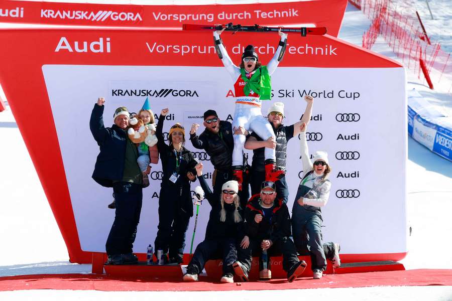 Lucas Pinheiro Braathen celebrates with his team after the giant slalom win