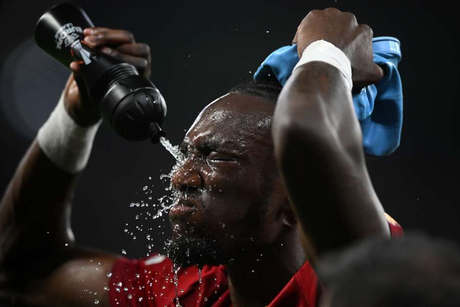 Tammy Abraham sprays water into his face