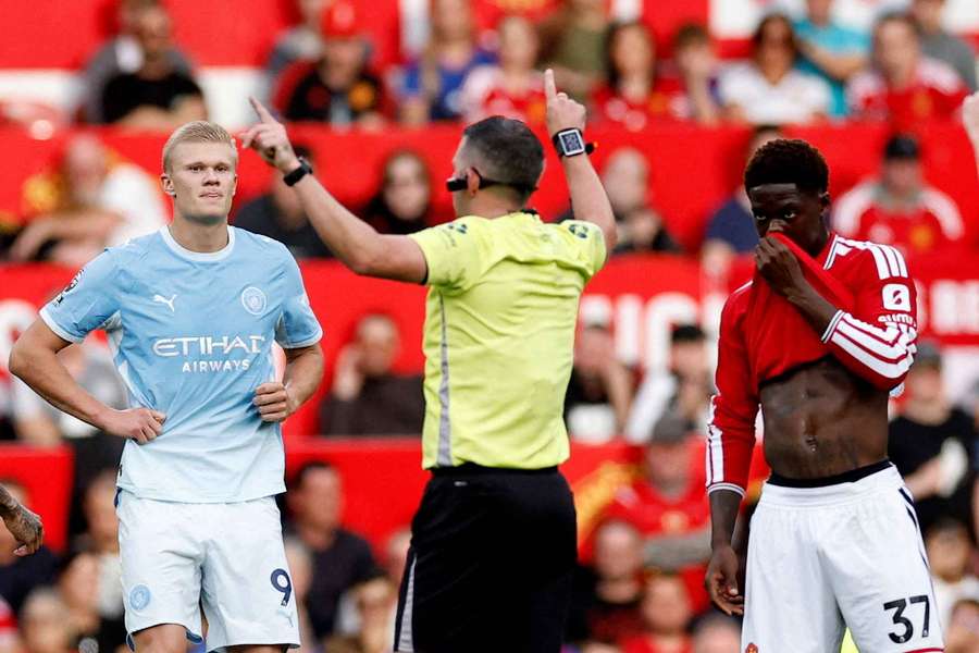 Manchester City's Erling Haaland reacts as referee Michael Oliver awards their goal following a VAR review