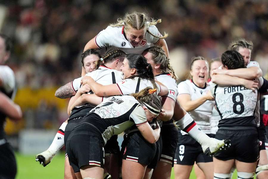 Canada celebrate after beating champions New Zealand in the Women's Rugby World Cup semi-final