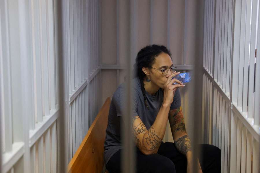 Brittney Griner inside a defendants' cage after the court's verdict in Khimki outside Moscow,