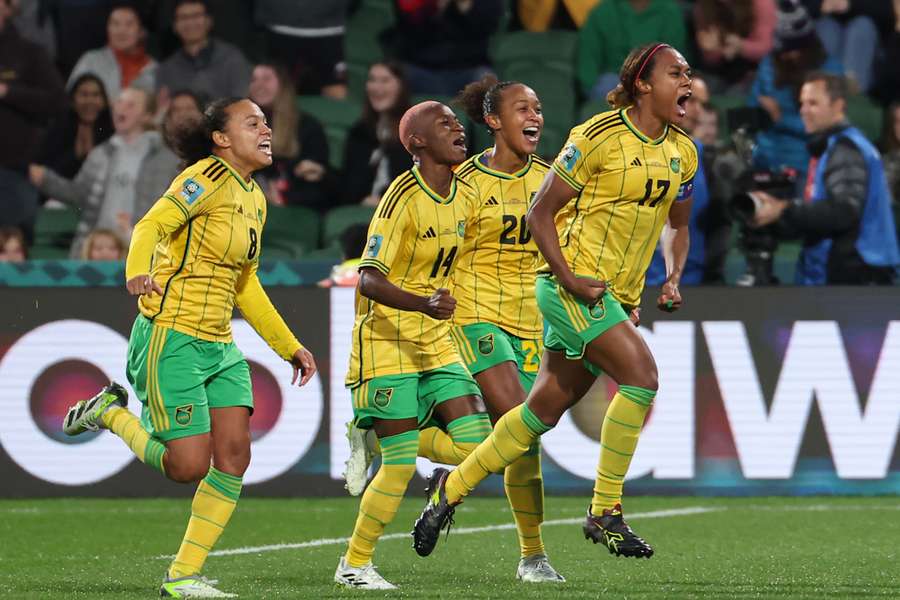 Jamaica defender Allyson Swaby (R) celebrates scoring