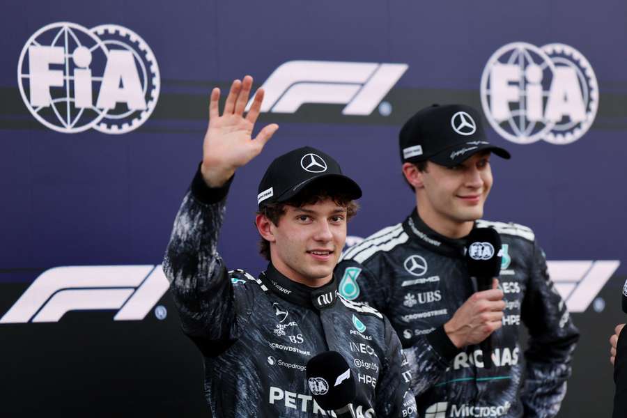 Mercedes' Andrea Kimi Antonelli celebrates after qualifying in pole position with second-placed George Russell