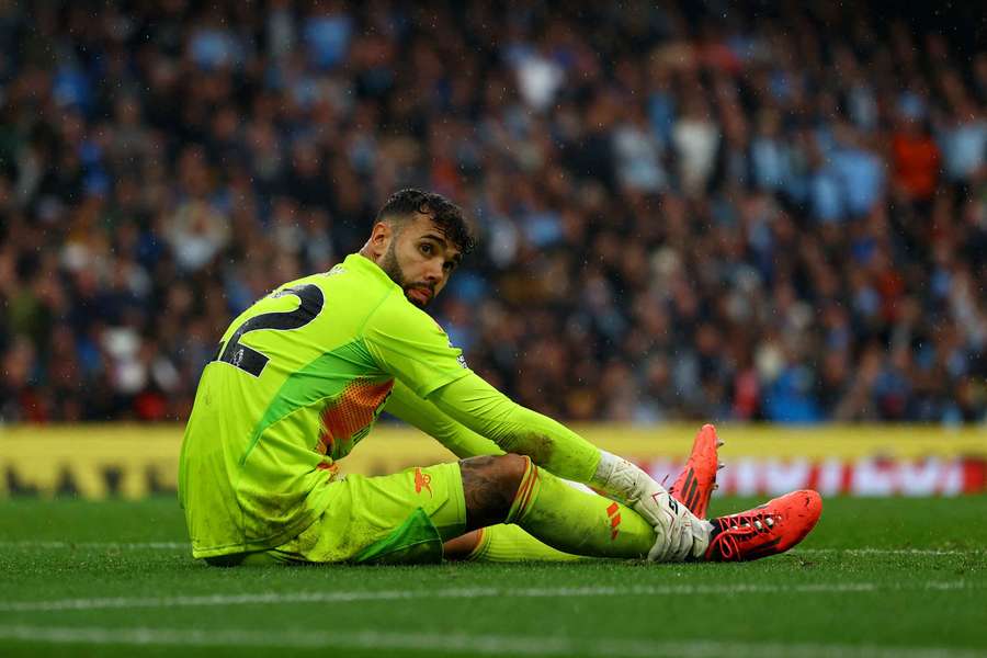 Arsenal's David Raya reacts after sustaining an injury