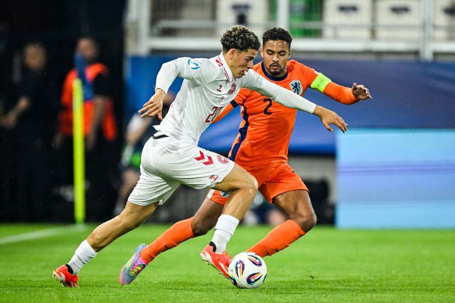 Denmarks Clement Bischoff battel for the ball with Devyne Rensch of the Netherlands