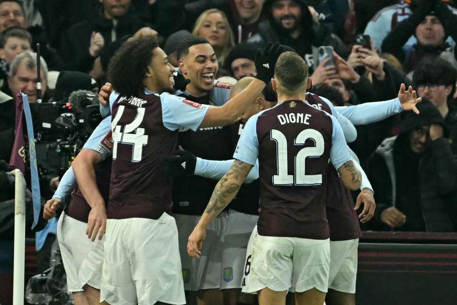 Morgan Rogers celebrates with teammates after giving Aston Villa a 2-0 lead