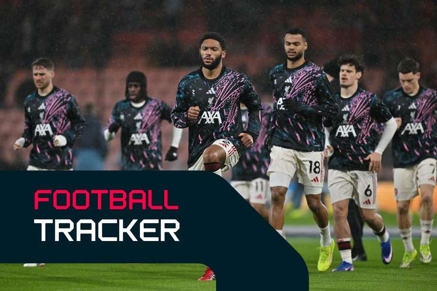 Liverpool's players warm up ahead of their game with Bournemouth