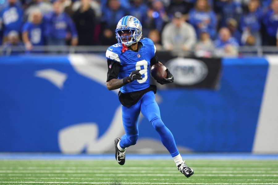 Lions wide receiver Jameson Williams running with the ball
