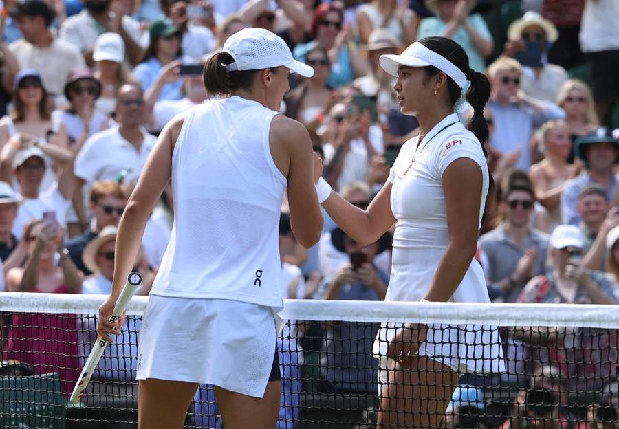 Swiatek (left) shakes hands with Eala Swiatek (left) shakes hands with Eala