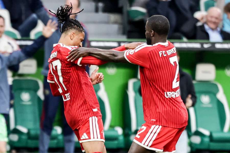 Olise and Upamecano celebrate the former's winner