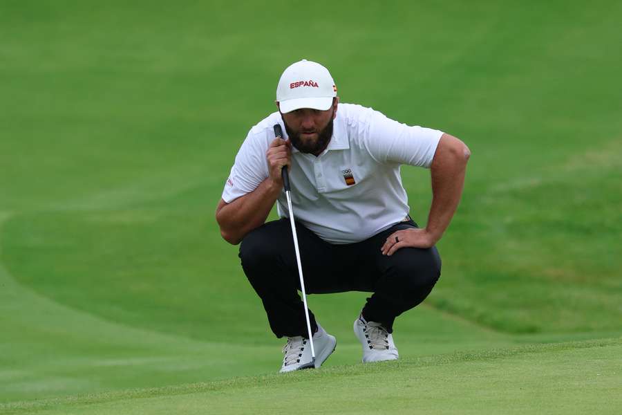 Spain's Jon Rahm lines up a shot in round three