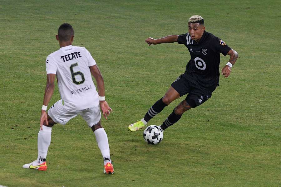 MLS All-Stars defender Julian Araujo (right) controls the ball against Liga MX All-Stars defender William Tesillo (left)