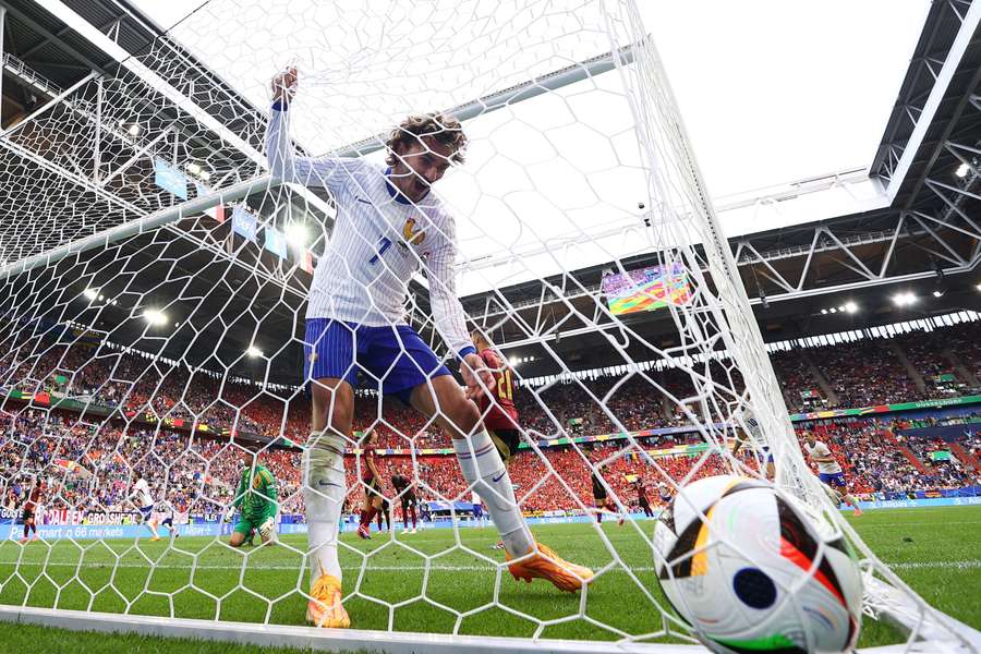 Antoine Griezmann grabs the ball after France's winner against Belgium