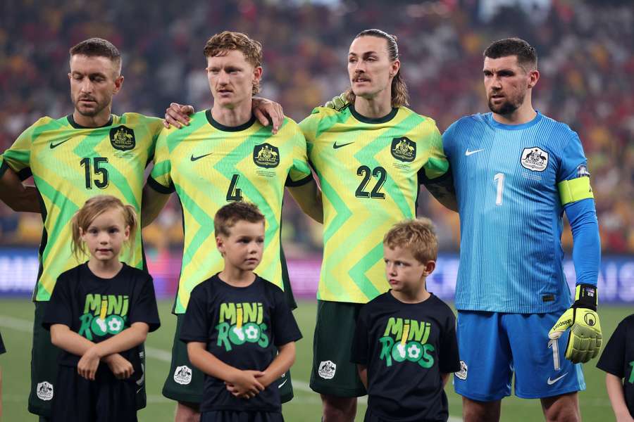 Mat Ryan (right) of Australia lines up for national anthems ahead Australia's World Cup qualifier against Indonesia