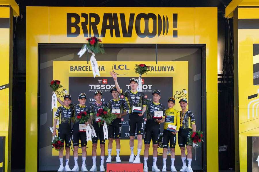 Team Visma Lease a Bike on the podium after winning the team time trial on the first stage of the Tour de France