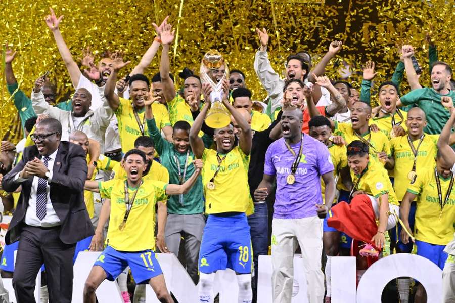 Mamelodi Sundowns players lift the trophy after winning the CAF Champions League in 2026