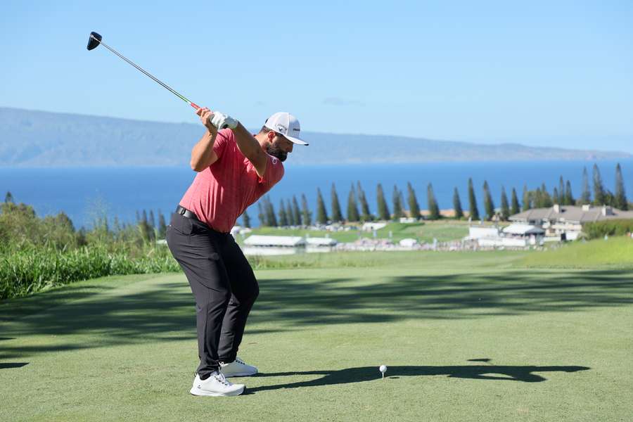 on Rahm of Spain plays his shot from the 18th tee during the final round of the Sentry Tournament of Champions