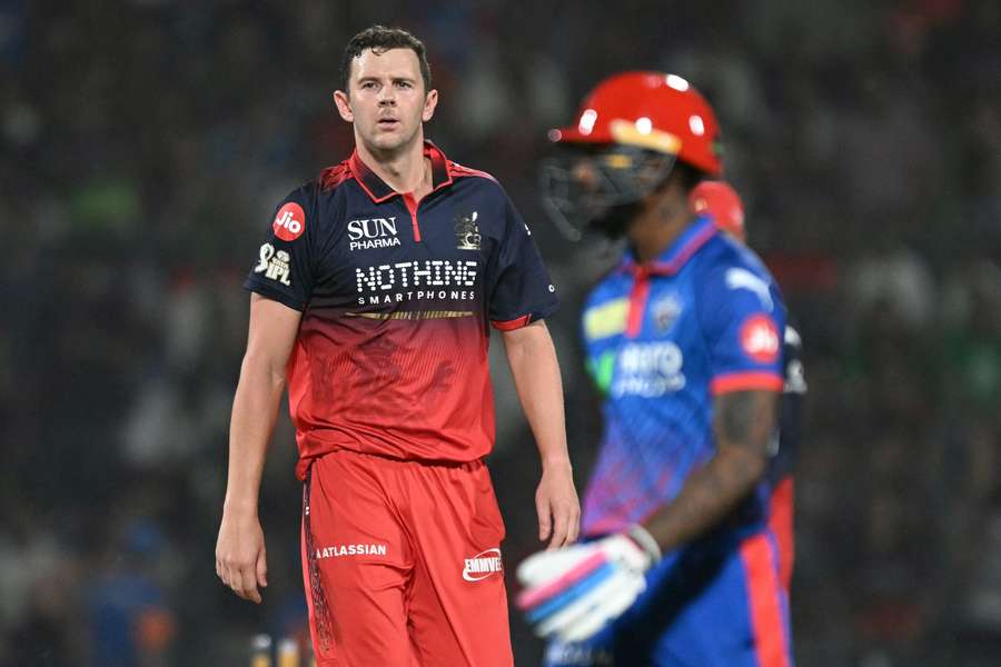 Josh Hazlewood sees off Delhi Capitals batter Abishek Porel overnight.