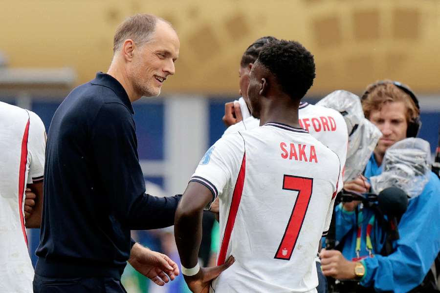 Tuchel speaking with Saka after the game
