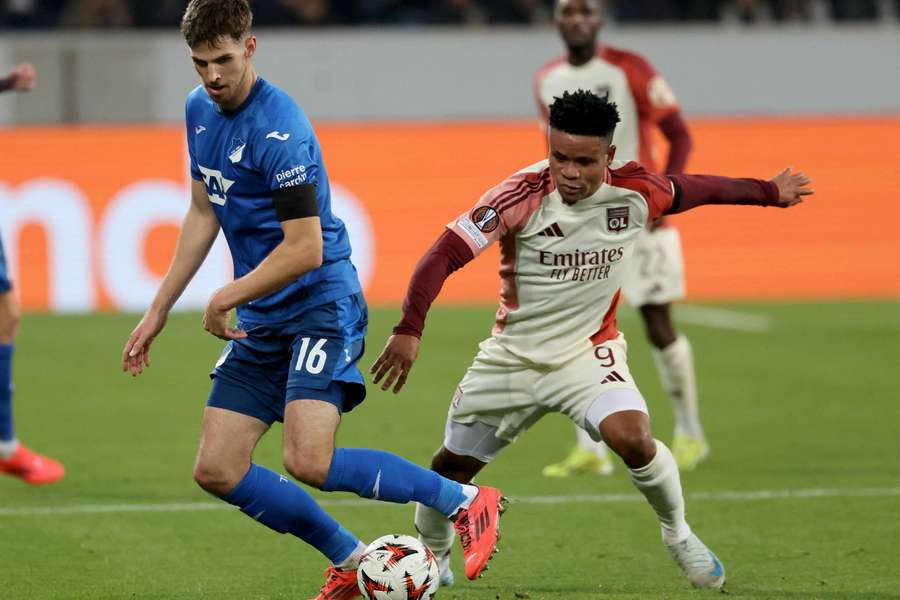 Anton Stach, left, and Lyon's Nigerian forward Gift Orban vie for the ball 