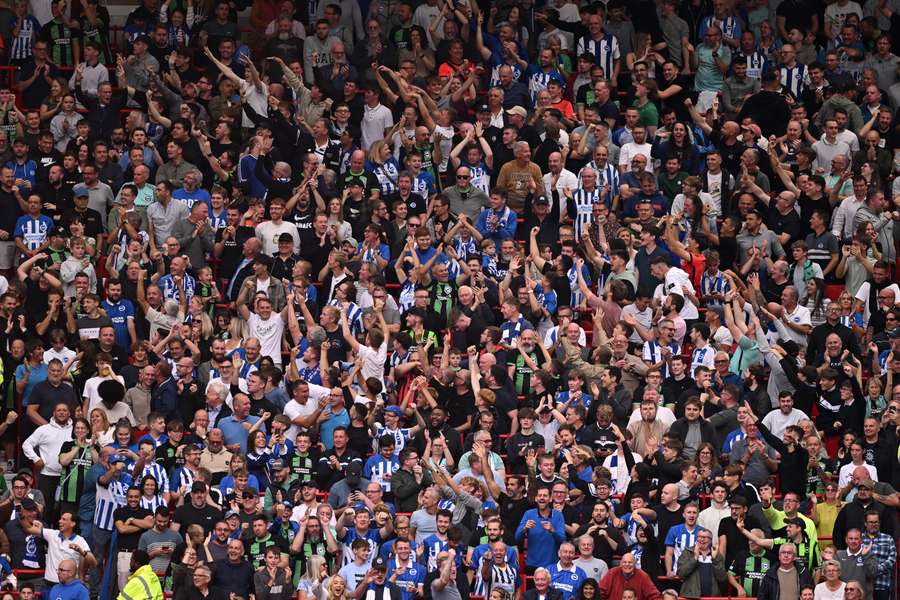 Brighton's fans celebrate as they go 3-0 up at Old Trafford