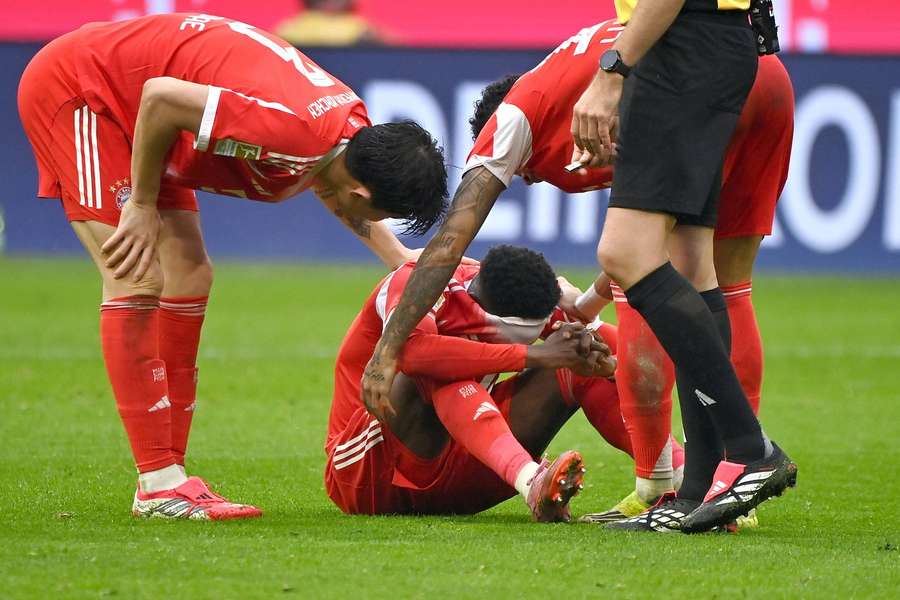 Davies reacts after sustaining his injury