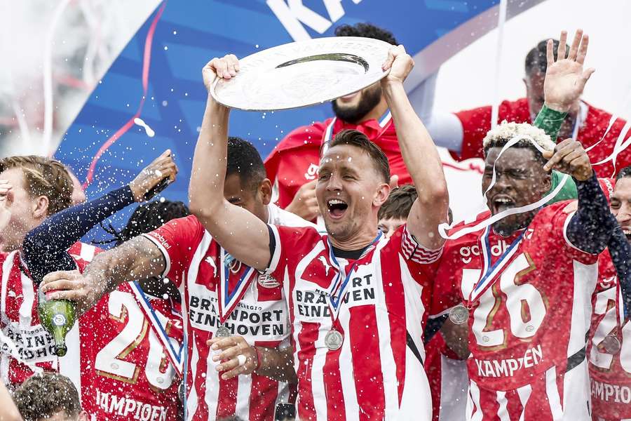 PSV captain Luuk de Jong lifts the Eredivisie trophy after beating Sparta in May