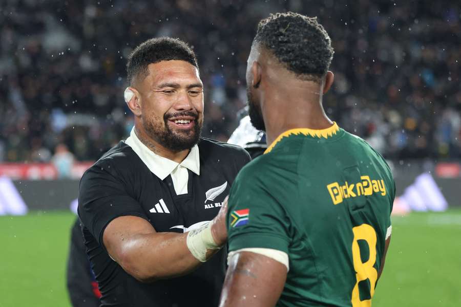 Ardie Savea and Siya Kolisi embrace one another after last weekend's epic.