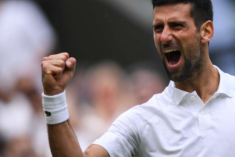 Serbia's Novak Djokovic celebrates winning against Russia's Andrey Rublev