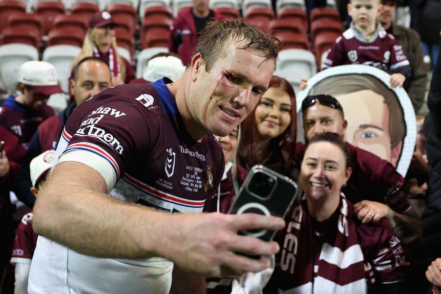 A bloodied and battered Jake Trbojevic takes a selfie with supporters at Brooky. A bloodied and battered Jake Trbojevic takes a selfie with supporters at Brooky.