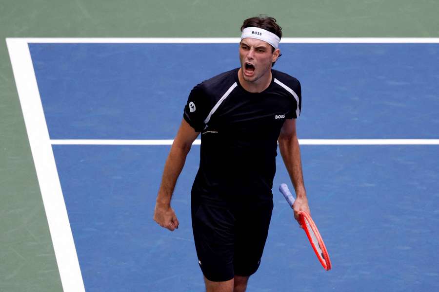 Taylor Fritz celebrates winning his second-round match against Italy's Mattia Bellucci Taylor Fritz celebrates winning his second-round match against Italy's Mattia Bellucci