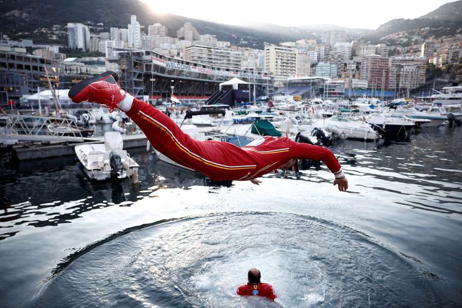 Ferrari's Charles Leclerc jumps into the marina after winning the Monaco Grand Prix